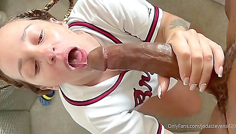 Ebony babe with a tattoo face gets cum on her face