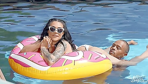 Tattooed chick plays with a stick and a penis outdoors