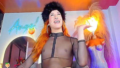 Busty redhead in lingerie enjoys a solo with her lover