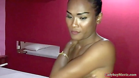 Asian milf with a nice tits sucks a dildo on camera